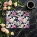 Sophisticated peony pattern wallpaper installed in a modern dining room setting