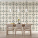A modern home office with a light and organized geometric wallpaper backdrop