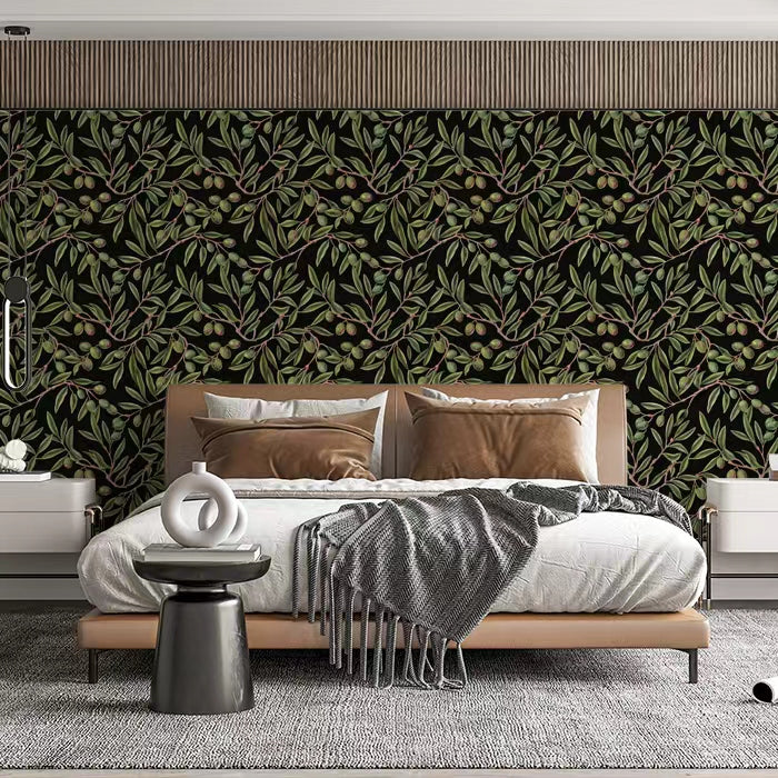 A refined home office with olive-patterned mural wallpaper and warm brass lighting.