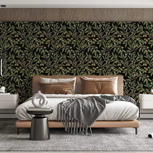 A bedroom with dark olive leaf wallpaper providing a calming, natural backdrop.