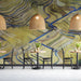 Bar with a serene abstract landscape mural providing a backdrop for a minimalist wooden table.