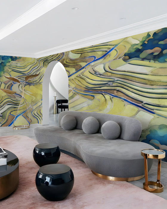 Living room interior featuring an abstract terraced field wall mural behind a modern cream sofa.