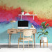 Study interior with a bold and energetic abstract mural on the main wall