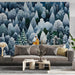 A cozy bedroom with a snowy forest mural on the wall and warm ambient lighting.