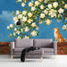 Living room with a mural of a Shiba Inu and magnolia tree on the main wall behind a cream sofa