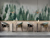 A serene bar with a mist-covered pine forest mural on the main feature wall behind the bed.