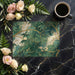 A sophisticated dining room featuring the gilded bamboo wallpaper as a dramatic focal point.