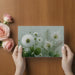 Elegant botanical mural accenting a bright and airy dining room wall