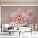 A peaceful home office space styled with light pink botanical mural wallpaper.