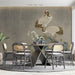 A serene dining room corner featuring the crane and rock mural, creating a refined and artistic workspace.