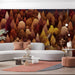 A cozy commercial space featuring an autumnal forest mural that brings a warm, woodland feel to the sleeping space.