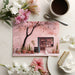 A bright dining room featuring a whimsical café scene mural with pink floral accents.
