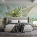 Soft green botanical floral mural installed as a feature wall in a tranquil minimalist bedroom