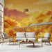 A cozy living room wall featuring an autumn train landscape mural behind a wooden headboard
