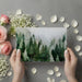 A quiet home office workspace featuring an artistic woodland wall mural to inspire creativity
