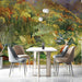 A peaceful dining room with an autumn watercolor forest mural creating a warm, inviting feature wall.