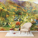 A cozy bedroom featuring an autumn landscape wallpaper behind a wooden headboard.