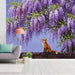 Reading nook with a wisteria garden mural providing a peaceful backdrop for a velvet armchair