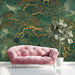 Sophisticated dining room interior with a dark forest green mural featuring intricate golden branches.