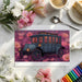 Vintage carriage design wallpaper in a creative home office with warm ambient lighting.