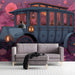 Dreamy botanical mural with antique carriage in a living room.