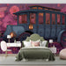 Whimsical floral mural wallpaper installed as a feature wall in a cozy bedroom with velvet decor.