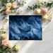 Modern home office with deep blue abstract fluid wave mural wallpaper