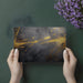 Modern office space with a moody dark and gold abstract mural providing a sophisticated professional backdrop