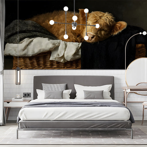 A calming bedroom scene with the sleeping Highland calf mural acting as a soft, artistic headboard.