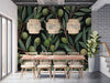 Moody dining room with olive branch wallpaper and dark velvet furniture