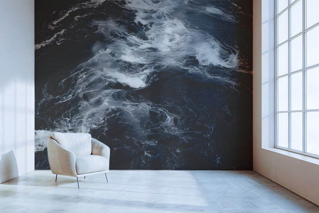 Dramatic living room wall featuring turbulent water mural behind a dark sofa
