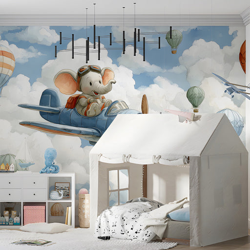 Kids bedroom wall featuring an elephant pilot mural with blue skies and hot air balloons
