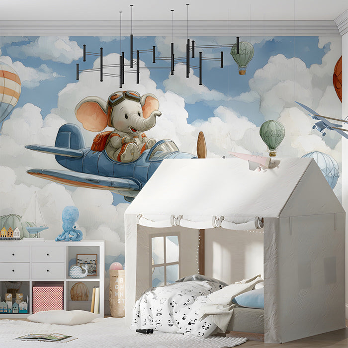 Kids bedroom wall featuring an elephant pilot mural with blue skies and hot air balloons