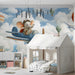 Kids bedroom wall featuring an elephant pilot mural with blue skies and hot air balloons