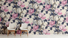 Floral wallpaper in a sophisticated entryway with velvet cushions.