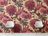 Vintage floral wallpaper installed as a feature wall in a moody, sophisticated entryway