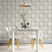 Bright minimalist dining room decorated with a subtle petal geometric wallpaper