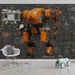 A creative workshop or studio space featuring a large-scale orange industrial robot mural on the main feature wall.