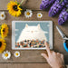 Charming mural featuring a cat and city scene styled in a cozy home office nook.