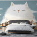 Giant fluffy cat illustration wallpaper used as a statement piece in a playful nursery interior.