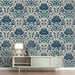 A grand, elegant entryway featuring a traditional damask mural wallpaper in blue and white tones.