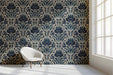 A sophisticated study featuring the navy and cream damask mural wallpaper on a main accent wall.