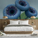 Serene bedroom setting featuring deep blue botanical wall art for a focused creative environment.