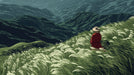 A scenic mountain mural with tall grasses in the foreground and a figure in a red dress overlooking a deep valley