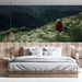 A tranquil reading nook designed with a naturalistic mountain grass wallpaper for a calm, escapist feel