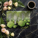 A stylish home office space decorated with a bold, graphic woodland forest mural wallpaper.