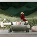 A quiet bedroom styled with the woman in a red dress wall mural and a velvet accent chair.