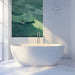 Bright bathroom with an artistic ocean wave wall feature