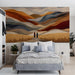Artistic hills wallpaper in a quiet bedroom with wooden furniture.