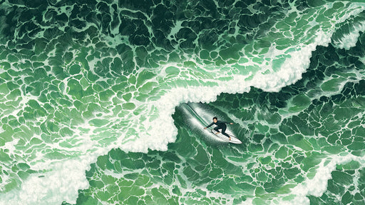 Aerial view of an emerald green ocean wave with a surfer carving a line in an artistic illustration style